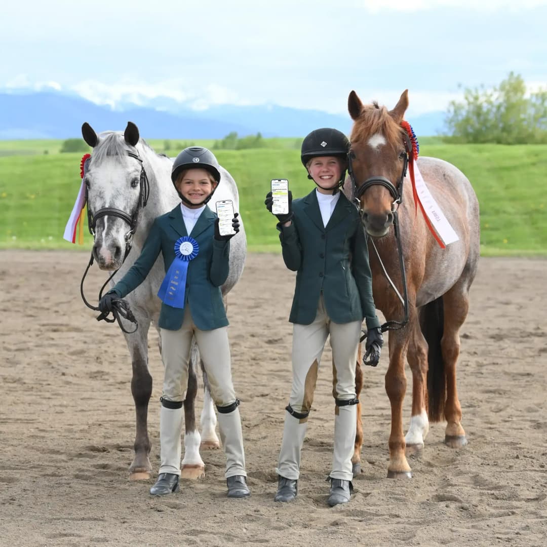 two girls with horses